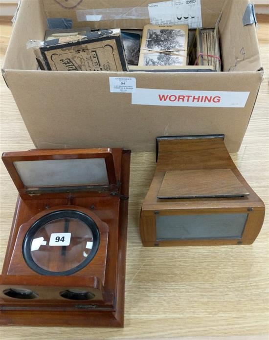 A mahogany stereoscope, another and collection of mixed stereoscopic photographic cards and glass slides 33cm long x 20cm wide